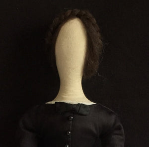 Madeleine's shoulders, face and hair are featured.